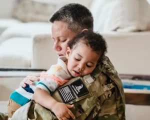 Military person with their child