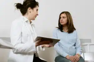 Doctor sitting with patient